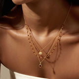 Satya | Embrace Change Garnet Lotus Triple Necklace