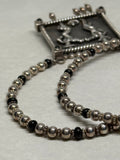 John Blair | "Hat Dance" silver necklace with black onyx